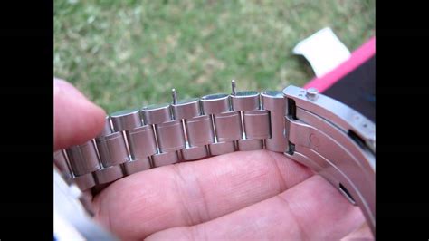 omega watch link removal